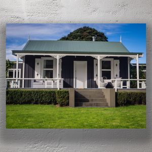 Charming Black and White Cottage with Veranda and Green Roof Photo Download