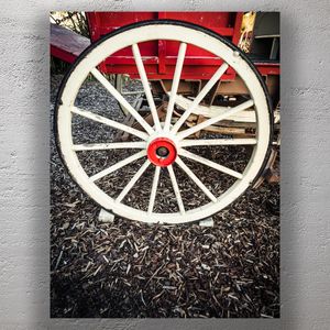 Vintage Wooden Wagon Wheel with Red Hub on Rustic Cart Photo Download