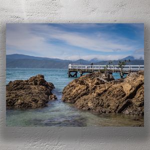 Scenic Coastal Fishing at Karaka Bay Wellington Tranquil Ocean and Mountain Views Photo Download