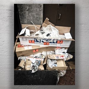 Urban Waste and Cardboard Recycling Overflow in City Alley Photo Download