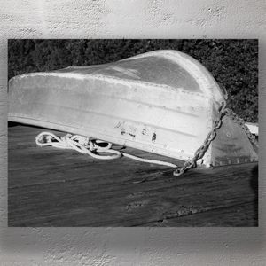 Weathered Upside-Down Rowboat on Wooden Dock Photo Download