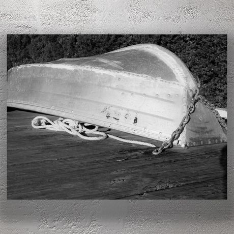 Weathered Upside-Down Rowboat on Wooden Dock Photo Download