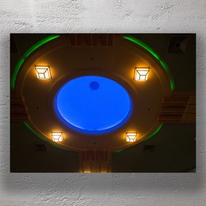 Art Deco Theatre Ceiling with Vibrant Blue Skylight and Warm Lighting Photo Download