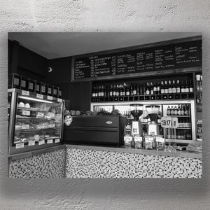 Cozy Café Interior with Coffee Menu Pastries, and Espresso Machine Photo Download