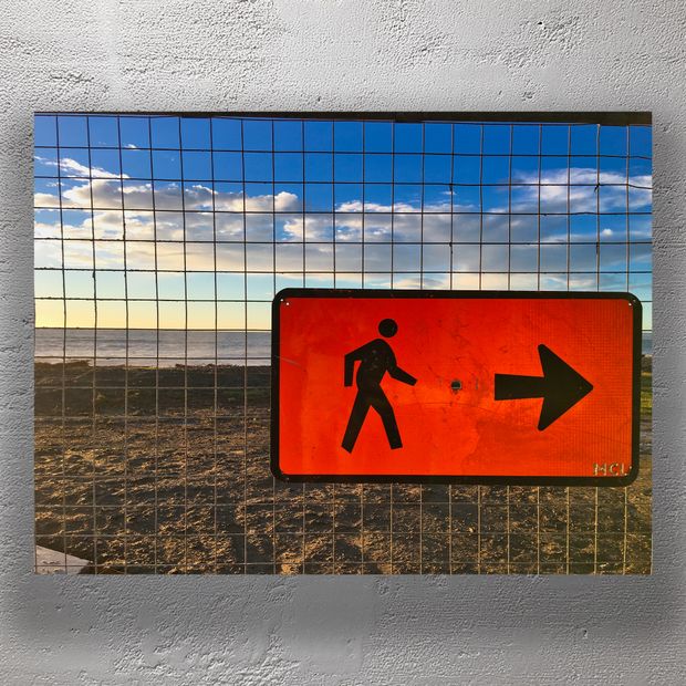 Bright Orange Pedestrian Sign Against Coastal Sunset Directional Walkway Photo Download
