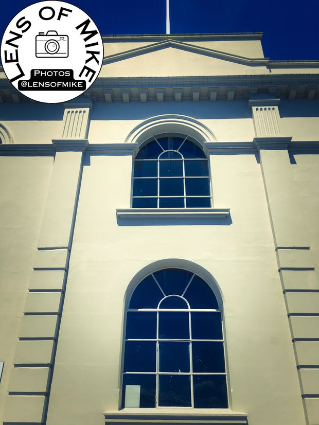 Elegant Neoclassical Architecture with Arched Windows Historic Building Photo Download