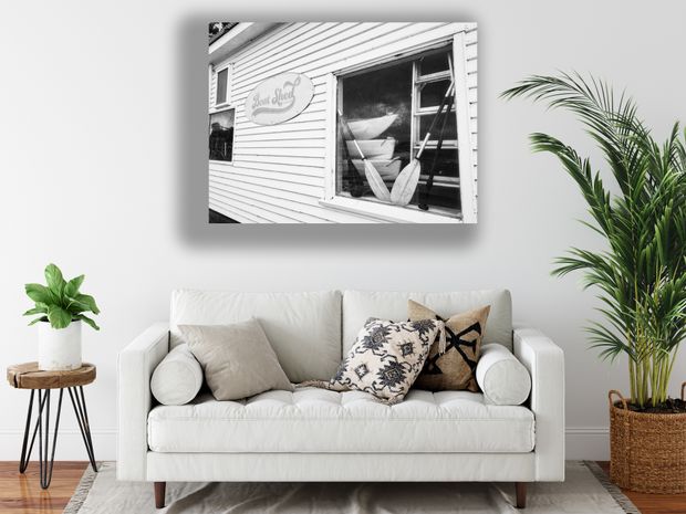 Vintage Boat Shed Exterior with Canoes and Paddles Photo Download