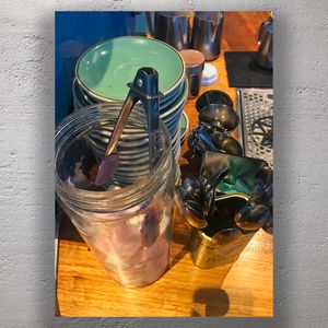 Rustic Café Counter Setup with Plates Utensils, and Marshmallow Jar Barista Station Photo Download