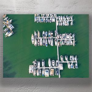 Aerial View of Marina with Docked Boats and Yachts on Calm Green Water Photo Download