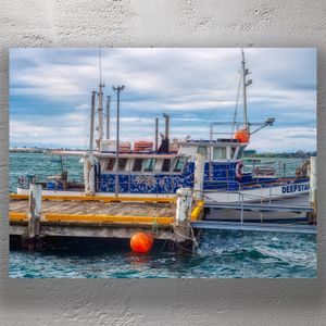 Rustic Fishing Boat Deepstar Docked at Windy Coastal Wharf Photo Download
