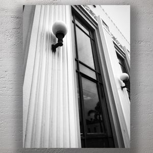 Art Deco Architecture with Globe Sconces and Reflected Palm Trees Photo Download