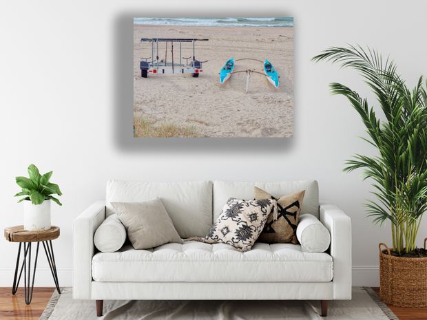 Twin Outrigger Canoes on Sandy Beach with Trailer by the Ocean Photo Download