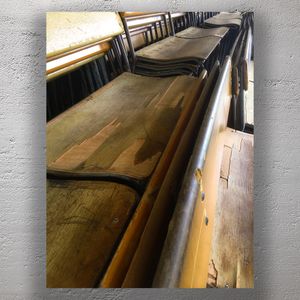 Vintage Wooden School Hall Chairs in Stacked Rows Aged and Rustic Seating Photo Download