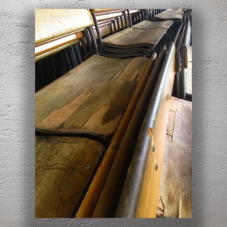 Vintage Wooden School Hall Chairs in Stacked Rows Aged and Rustic Seating Photo Download