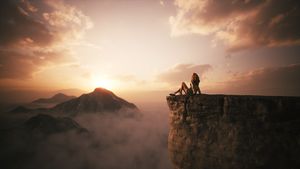 Girl sitting on the edge of a cliff