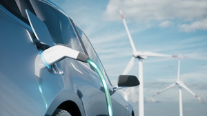 Car charging on the background of a windmills. Charging electric car