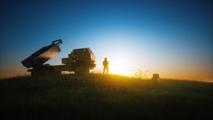 Multiple launch rocket system on the background of sunset sky