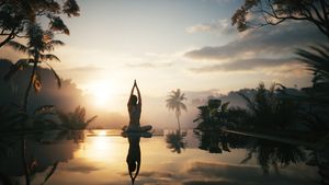 Woman does yoga exercise sitting in lotus pose