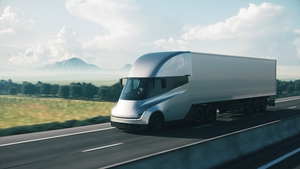 Cargo truck driving on a highway. Modern cargo truck at sunset