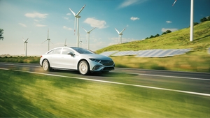 Electric car driving through landscape