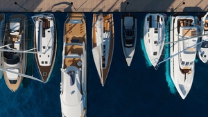 Aerial top-down view of docked sailboats. Top down view of yachts