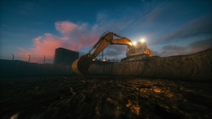 Excavator with big shovel in the excavation of the construction site