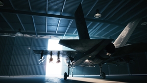 Opening the door of aircraft hangar