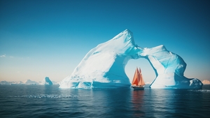 Red sailboat and melting iceberg