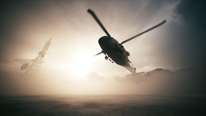 A military helicopter lands at a military base