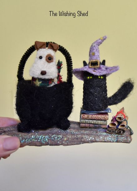 Naughty witchy Cat with dog in cauldron 