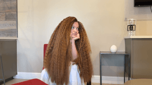 Undine Fluffy Red Hair on a Chair