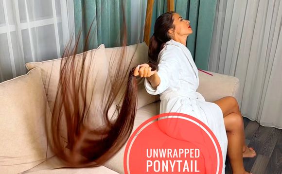 UNWRAPPED PONYTAIL — RAPUNZEL’S LONG HAIR SHOW IN A WHITE ROBE