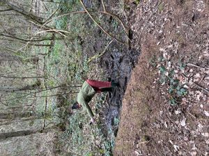 Missa Rae dancing in the mud