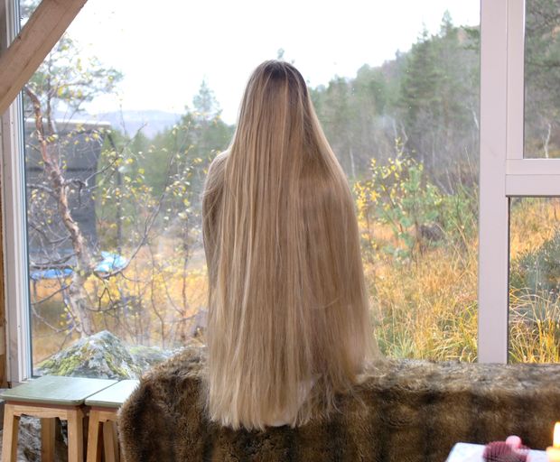 VIDEO - Massive, healthy blonde hair display by the window
