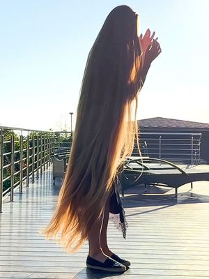 VIDEO - Blonde floor length hair by the pool