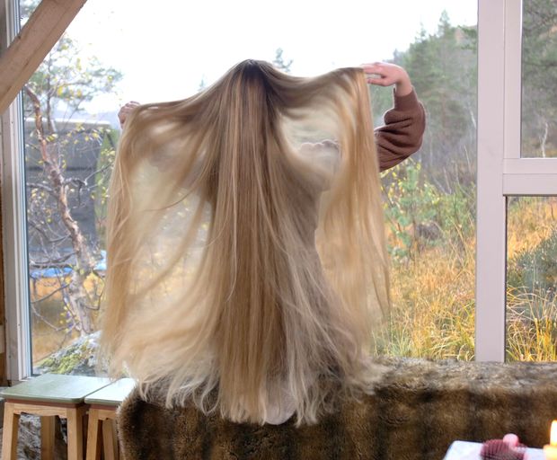 VIDEO - Massive, healthy blonde hair display by the window