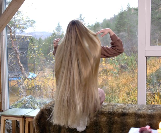 VIDEO - Massive, healthy blonde hair display by the window