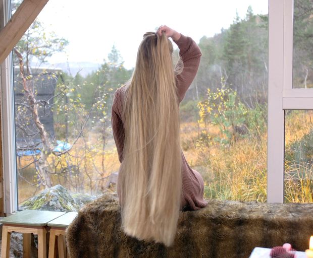 VIDEO - Massive, healthy blonde hair display by the window