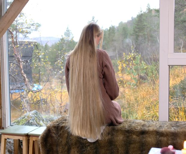 VIDEO - Massive, healthy blonde hair display by the window