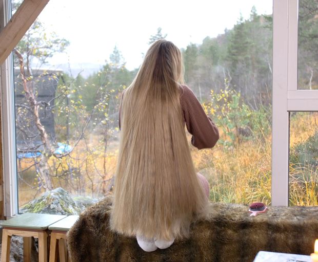 VIDEO - Massive, healthy blonde hair display by the window