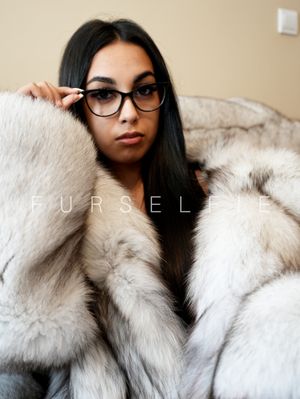 Gigi wears glasses and blue fox fur coat (167)