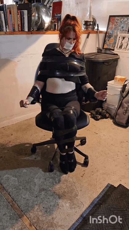Madame Infini Taped To Chair 
