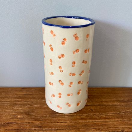 Orange pineapple stamped short vase with blue trim