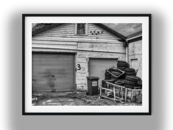Weathered Workshop Garage with Stacked Tires Black And White Photo Digital Download