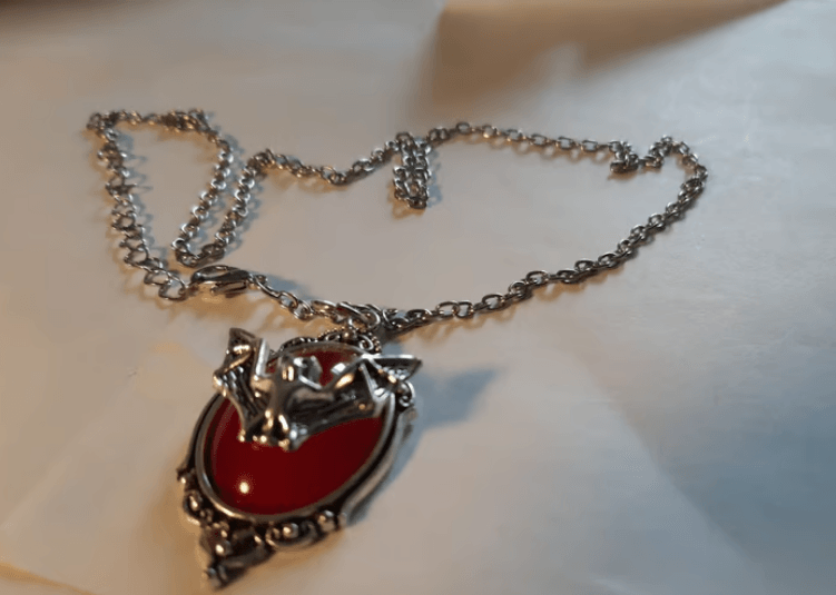 =Barbed wire Bat necklace.