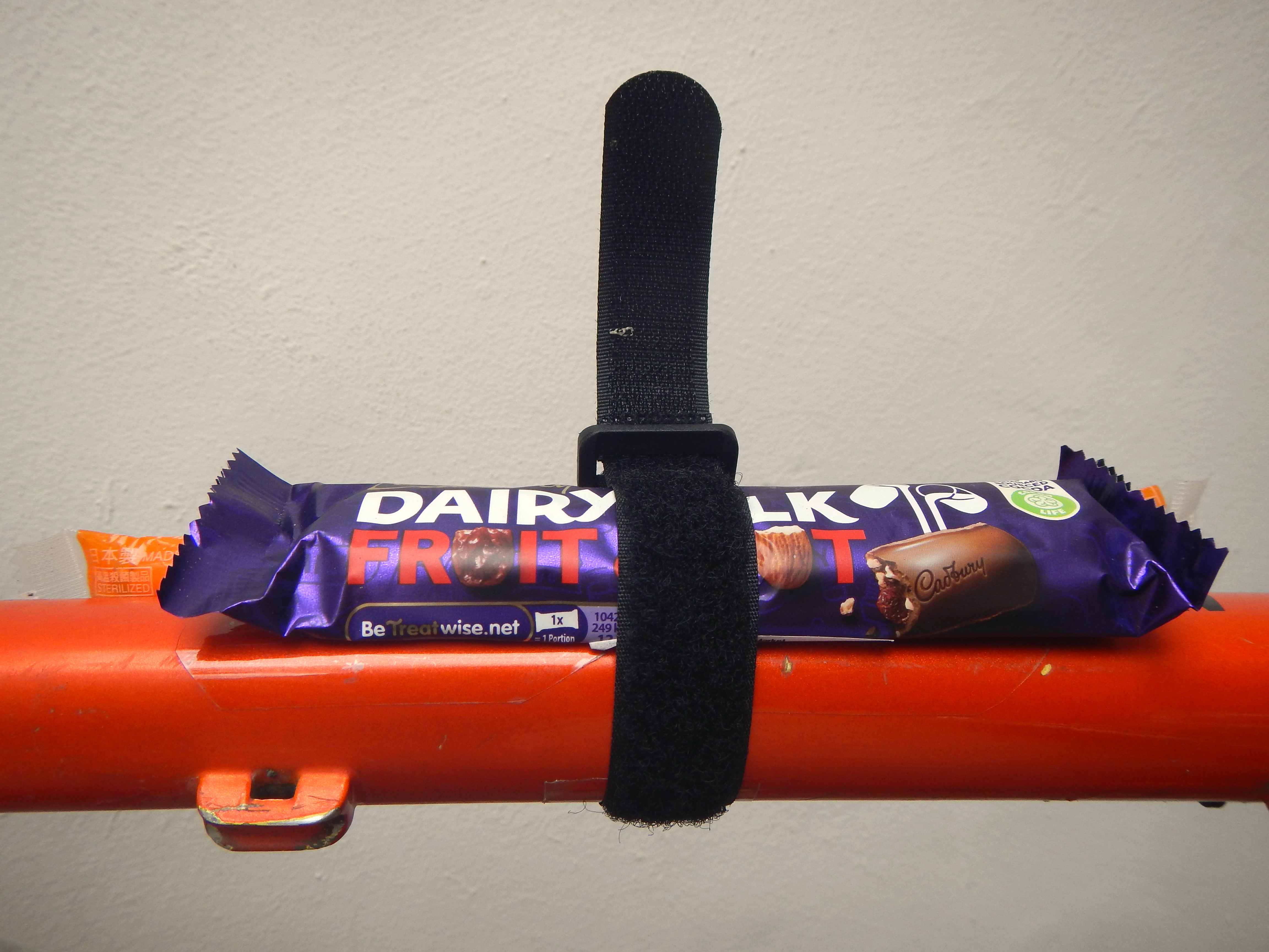 Snack strap holds energy or food bars on your bike